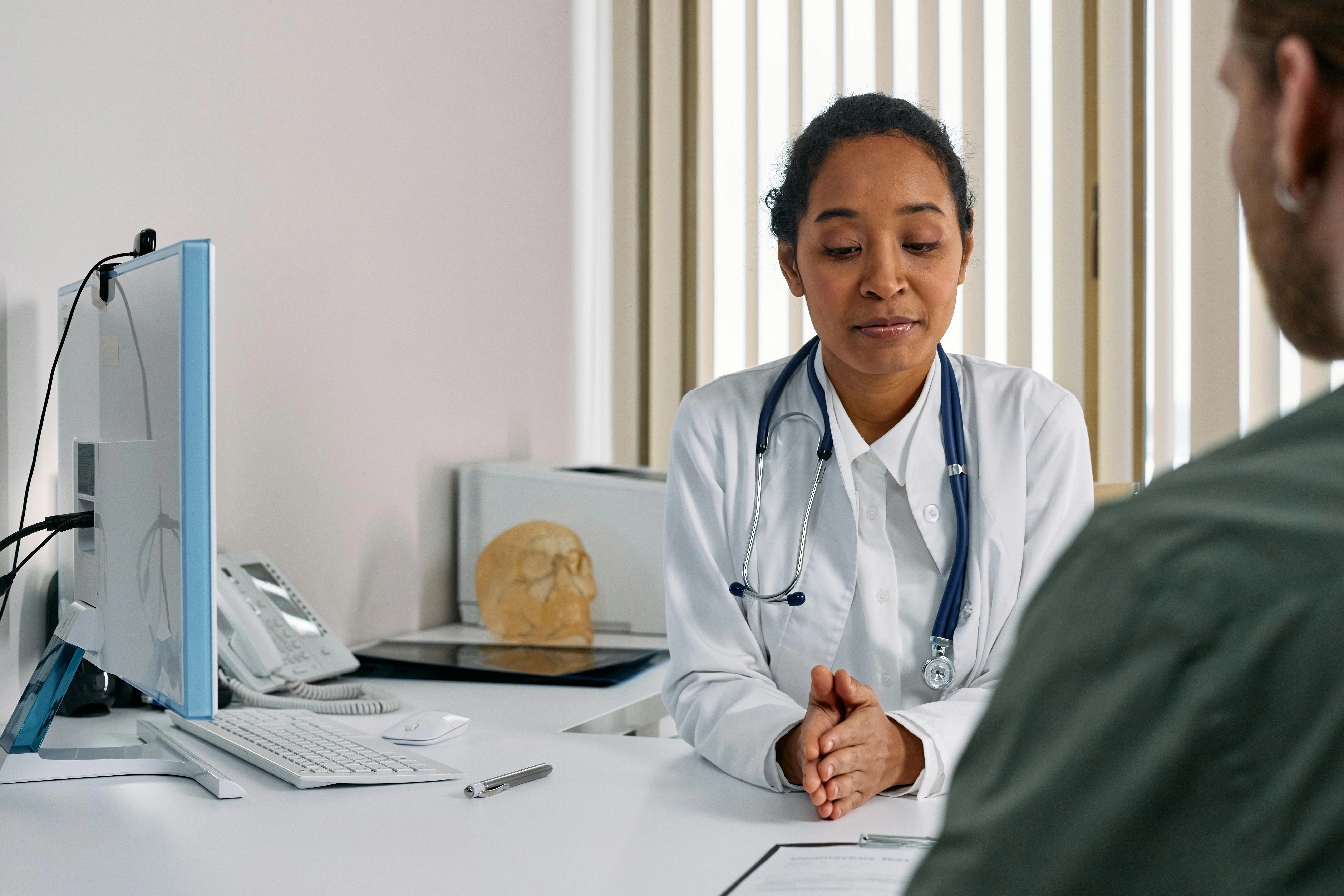 Hyperhidrosis specialist doctor consulting a patient in clinic